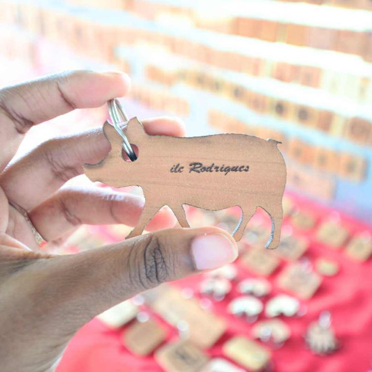 Atelier Boutik Artisanal woodwork of a keyring in a pig shape in Rodrigues Island by Mr. Hortense
